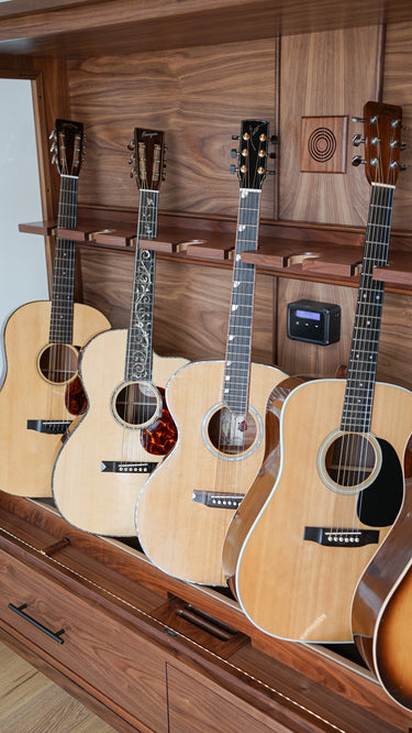 climate controlled guitar cabinet by american music furniture with acoustic instruments 